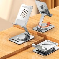 Silver stand shown in three positions, including folded and fully extended with an arrow indicating rotation