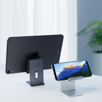 Multi-device setup featuring a tablet and smartphone supported by sleek adjustable holders in dark gray and silver