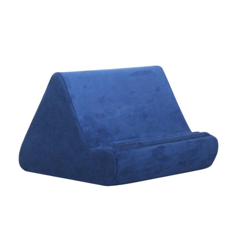 Blue velour pillow tablet stand with angled back and rounded front support.