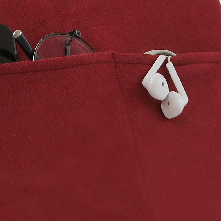 Close up shot of the back pockets with glasses and earbuds inside.