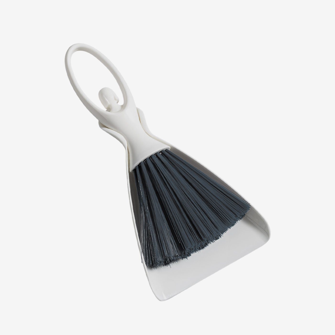 Mini desktop cleaning brush set in white and gray, stored neatly in its compact dustpan.
