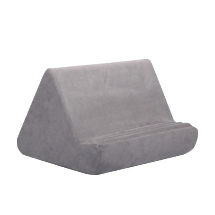 Gray velour pillow tablet holder with angled back and rounded front support.