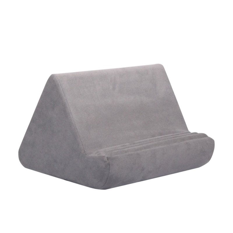 Gray velour pillow tablet holder with angled back and rounded front support.