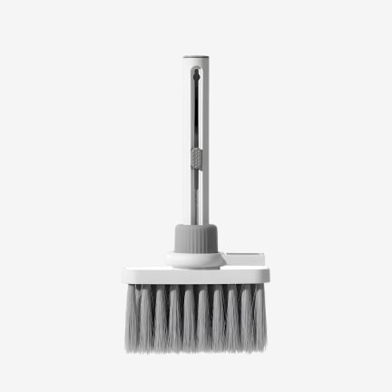 White multifunctional keyboard cleaning kit with keycap puller and earbud cleaning pen attached.