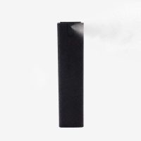 Front view of black phone screen cleaner spray bottle with microfiber sleeve spraying mist.