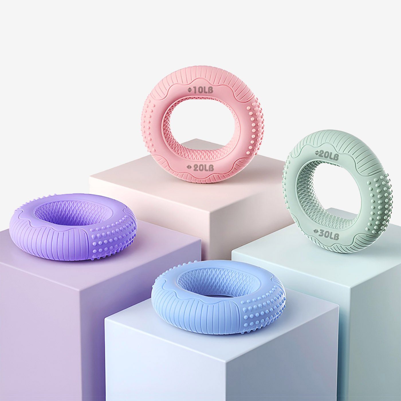 Set of four silicone hand grip strengthener rings in progressive resistance levels from 10LB to 60LB.